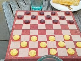 Checkers, one of the games provided