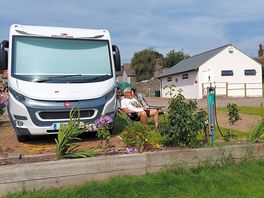 View of our camper on site from the church yard.
