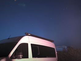 Night sky with the camper van and fire pit