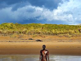 Anthony gormley art installation at crosby beach