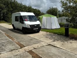 Van and tent on pitch