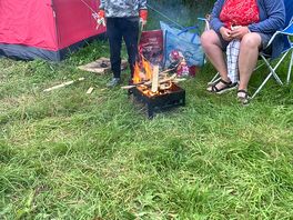 Having fun by the camp fire.