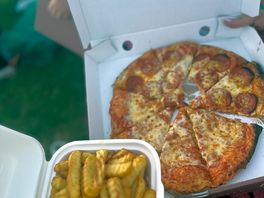 Pizza and chips delivered to our tent.