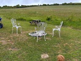 Chairs and picnic bench provided