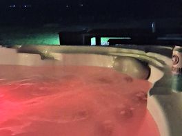 In the hot tub at night