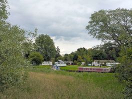 Campsite from footpath on other side of the river