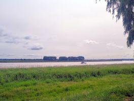 The kids enjoyed watching some boats pass.