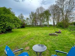 View from the hut towards the fire pit and campsite