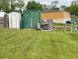 The two shower/ toilet cubicles and washing up area.