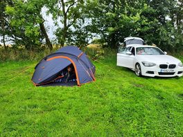 Nice ti park car near tent