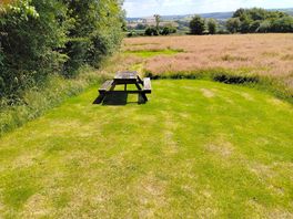 Level pitch with table great view. long grass separated camping spots