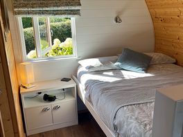 The double bed space at the back of the pod.