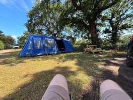 Large family tent on a spacious pitch.