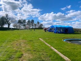 Our large tent on an unmarked pitch, with ehu. great area for the kids and dogs to play.