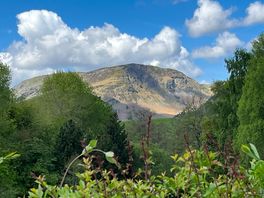 Site surrounded by mountains and hills