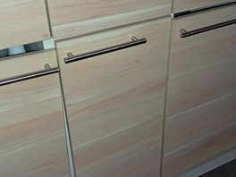 Doors hanging off kitchen units