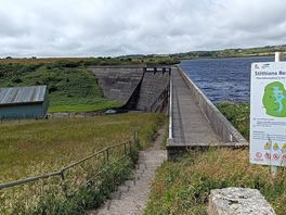 The dam which is halfway round the lake