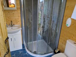 Compact bathroom with addition of heater to pre-warm the space before showering