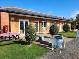 External view of bar, reception and toilets.