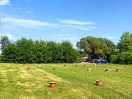 Electric hardstanding and grass pitch