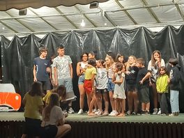 The teens singing on stage