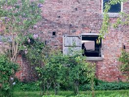 Toilet block is accessed through stable yard, through a small gate.