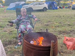 Keeping warm by the fire.