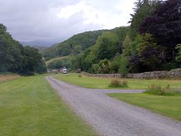 A view from the top of the site down towards the entrance. shower block is out of shot to the right