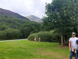 The huge playfield with picnic benches by the river