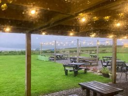 On site bar from inside on a rainy evening