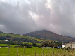 Peaceful welsh hills wrapped in clouds — even on a cloudy day, it’s breathtaking.