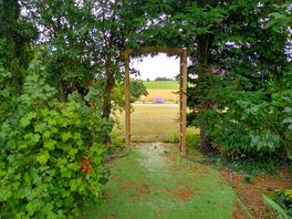 A way through from the vehicle pitches towards the dog walk.