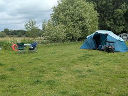 Photo of our pitch, tent and table and chairs.