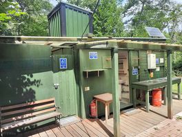Shower block with toilets and wasing up station.