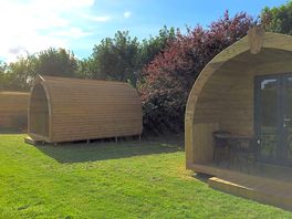 Pods in a secluded part of site but a few steps away from all facilities