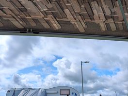Vehicle next to us and a bit of blue sky