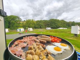 Breakfast on the cadac from our peaceful , level pitch .
