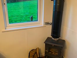 Lovely stove, and the owners will give you more logs as needed