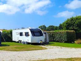 Pitch24 tugged beside a hedge