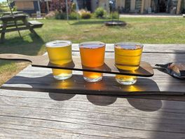 Flight of ciders from the taproom in the beer garden on site