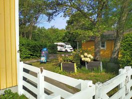 Among the trees, but still close to town and station.