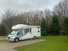 Spacious hard standing pitch with grass area around