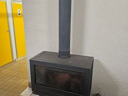 Wood heater in shower block