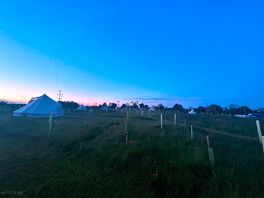 Sunset over the site sitting by the fire pit