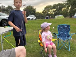 Kids enjoying the campfire marshmallows