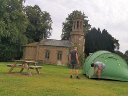 Setting up our tent by the chapel. beautiful view.