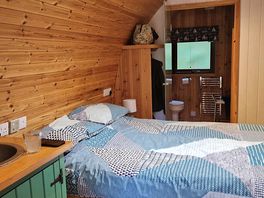 Comfy made up double bed.