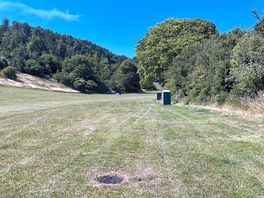 View uphill to extensive open space