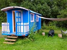 Pink gypsy caravan with outdoor awning