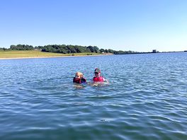 Having a swim in the lake while kayaking